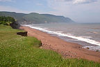 Red sand beach on Aspy Bay