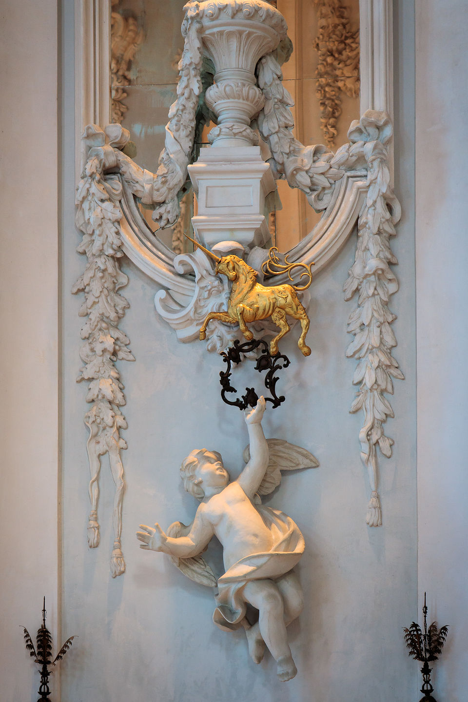 Putti holding a unicorn - the heraldic symbol of the Borromeos