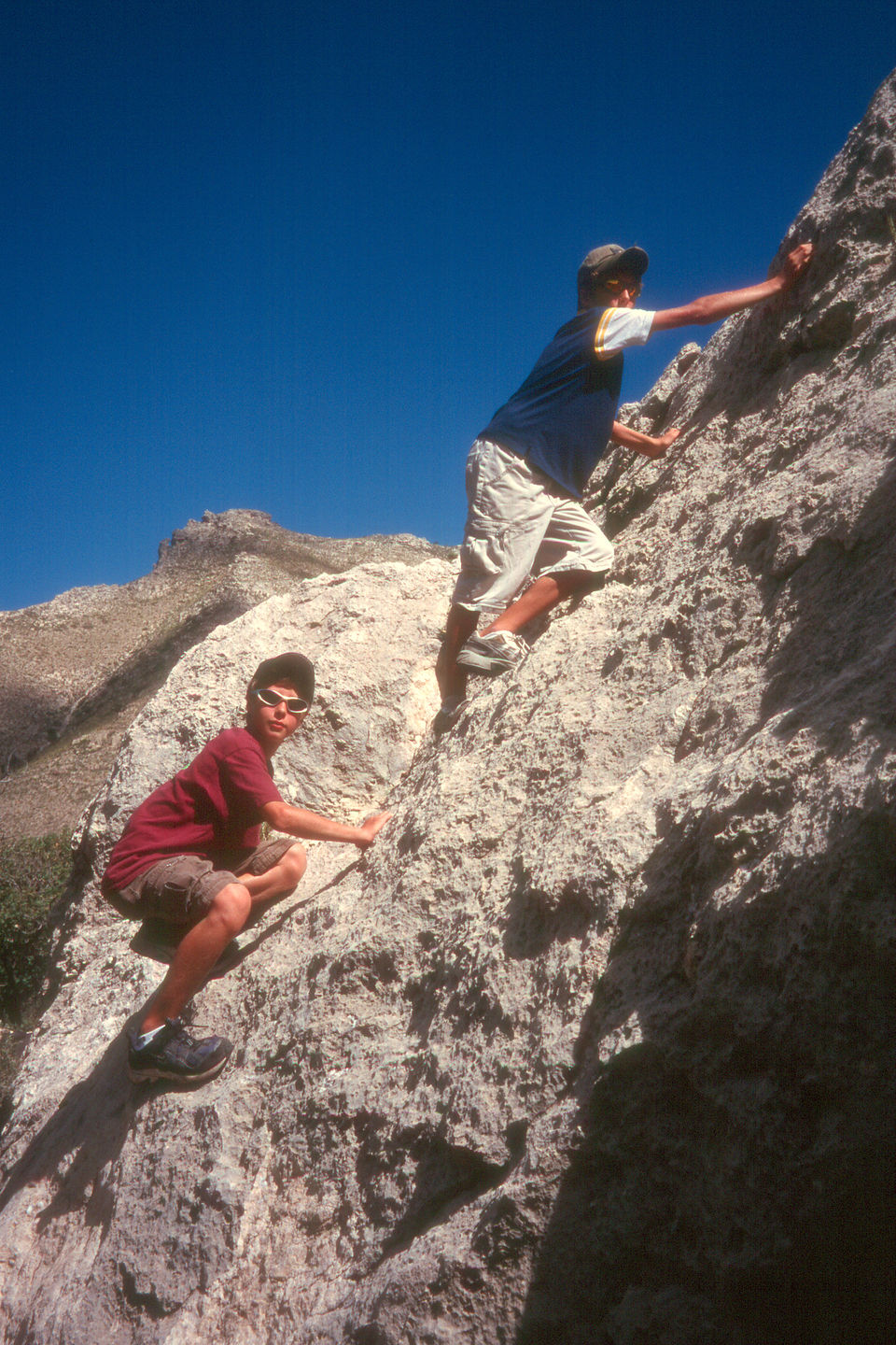 Boys rock scrambling on Devils Hall Trail