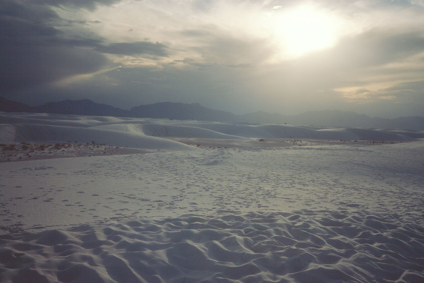 Sun setting over dunes