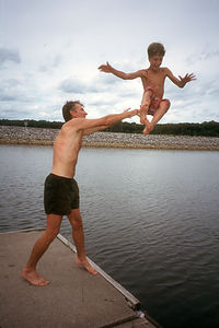 Herb tossing Tommy in Lake Barclay