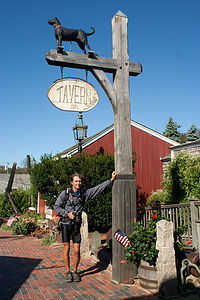 Herb holding up Black Dog Tavern Sign - LEG