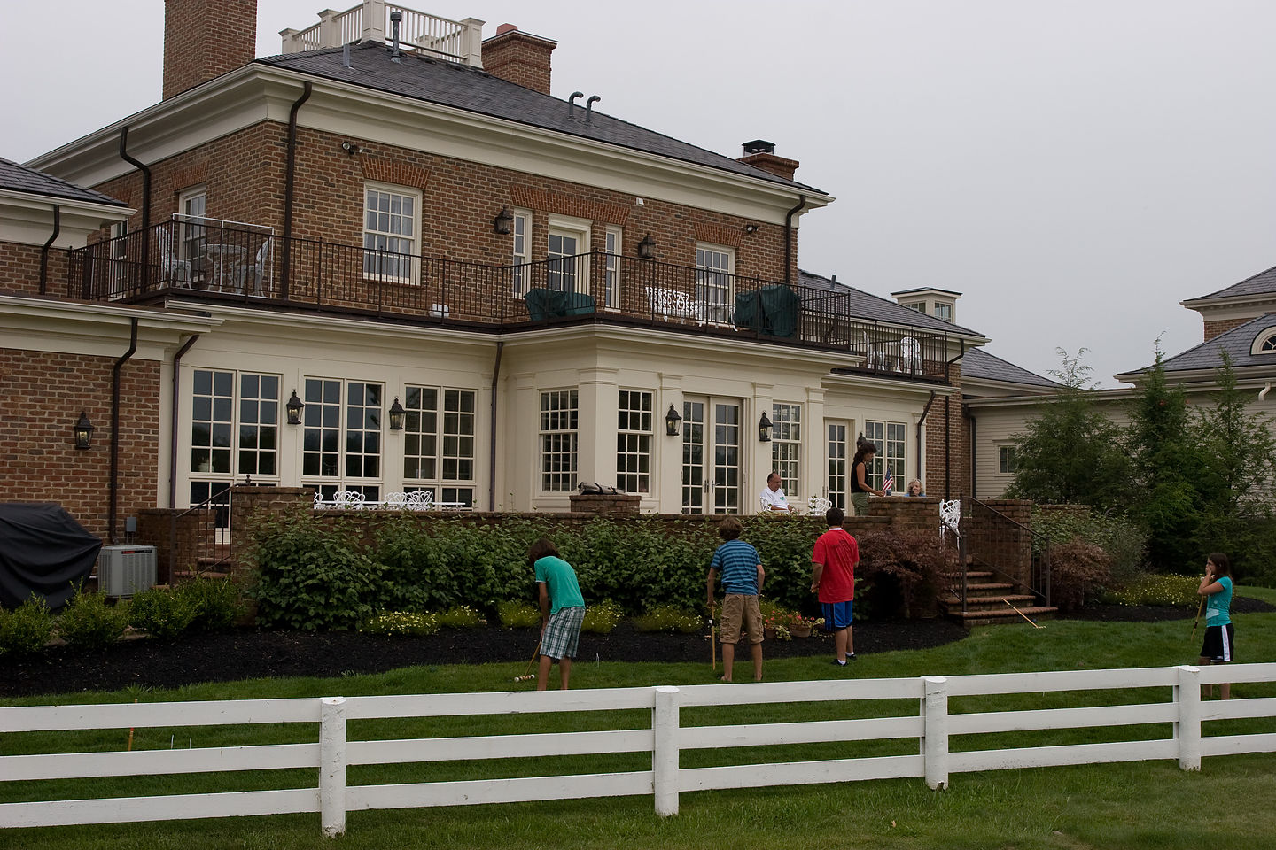 Gang playing croquet in the backyard